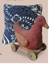  ??  ?? RIGHT An indigo-fabric lavender-filled cushion; an early 20th-century French duck on wheels toy, £65.