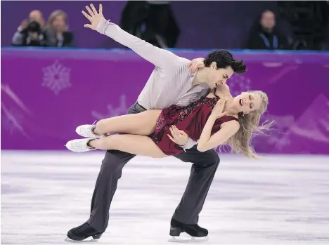  ?? PAUL CHIASSON/THE CANADIAN PRESS ?? Kaitlyn Weaver and Andrew Poje will be the country’s premier dance team at the world championsh­ips in Milan.