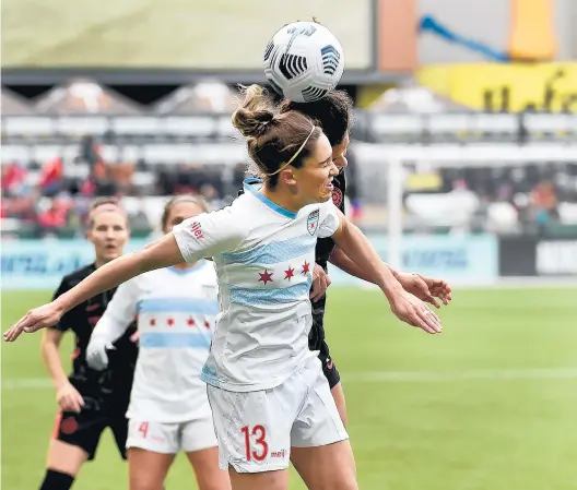  ?? STEVE DYKES/GETTY ?? Morgan Gautrat of the Chicago Red Stars goes up for a ball during the first half against the Portland Thorns on Sunday.