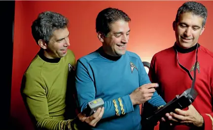  ??  ?? Brothers George, Basil and Gus Harris examine prop tricorders from the Star Trek series; the Harris siblings named their team Final Frontier Medical Devices.