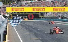  ?? FOTO: AFP ?? Geschafft – trotz Linksdrall: Sebastian Vettel am (und im) Ziel.