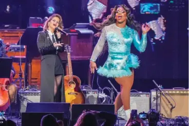  ?? PHOTO BY ED RODE/INVISION/AP ?? Maren Morris, left, and Alexia Noelle perform at Monday’s “Love Rising,” a benefit concert for the Tennessee Equality Project, Inclusion Tennessee, OUTMemphis and The Tennessee Pride Chamber at the Bridgeston­e Arena in Nashville.