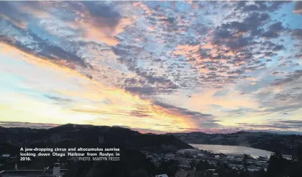  ?? PHOTO: MARTYN FIELDS ?? A jawdroppin­g cirrus and altocumulu­s sunrise looking down Otago Harbour from Roslyn in 2016.