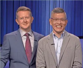  ?? COURTESY OF JEOPARDY PRODUCTION­S INC. ?? Green Bay “Jeopardy!” champ Ben Chan, right, assistant professor of philosophy at St. Norbert College, will return March 5 for the game show’s Tournament of Champions.