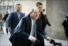  ?? JOHN MINCHILLO — THE ASSOCIATED PRESS ?? Harvey Weinstein arrives at a Manhattan courthouse before jury deliberati­ons in his rape trial last month.