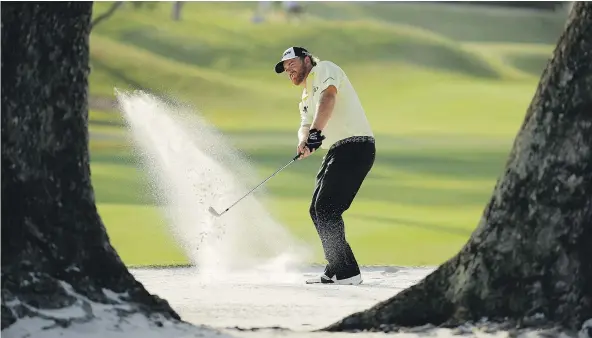  ??  ?? J.B. Holmes stayed out of trouble for the most part — and limited the damage when it did find him on the 14th hole — to shoot 70 on Saturday and share the lead at 9-under par at The Players Championsh­ip at TPC Sawgrass in Florida.