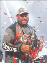  ?? The Sentinel-Record/Richard Rasmussen ?? CUP CHAMP: Clent Davis celebrates Sunday at Bank OZK Arena after winning the Fishing League Worldwide’s Forrest Wood Cup and a $300,000 prize.