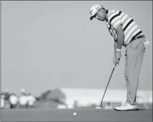  ?? The Associated Press ?? OPENING ROUND: Marc Leishman putts on the 18th hole during the first round of the AT&T Byron Nelson golf tournament Thursday in Dallas to close out a 10-under 61, the leading score in the first round.