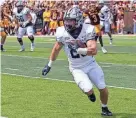  ?? COURTESY MICHELLE BRONNER ?? Dylan Laube, seen here in last week’s game at Central Michigan, rushed for 180 yards and scored two touchdowns to lead the 11th-ranked New Hampshire to Saturday night’s 24-7 victory against Dartmouth at Wildcat Stadium.