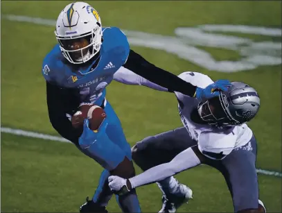  ?? PHOTOS BY JOHN LOCHER — THE ASSOCIATED PRESS ?? Nevada defensive back EJ Muhammad tackles San Jose State wide receiver Tre Walker during the second half in Las Vegas last week.