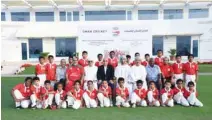 ??  ?? BUDDING CRICKETERS: Omani junior players with cricket officials.