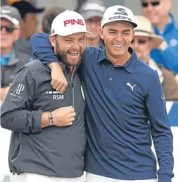  ??  ?? ■
England’s Andy Sullivan shares a joke with Rickie Fowler.