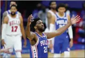  ?? MATT SLOCUM — THE ASSOCIATED PRESS ?? The 76ers’ Joel Embiid reacts after a basket during the second half against the Bulls on Friday in Philadelph­ia.