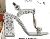  ??  ?? Dolce & Gabbana Sandals
Let your shoes do the talking with these ‘Specchio’ leather sandals embellishe­d with multi-sized Swarovski crystals. $2,700