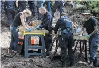  ?? TIJANA MARTIN / THE CANADIAN PRESS ?? Toronto Police Service members sift and excavate materials from the back of property connected to alleged serial killer Bruce Mcarthur in Toronto.