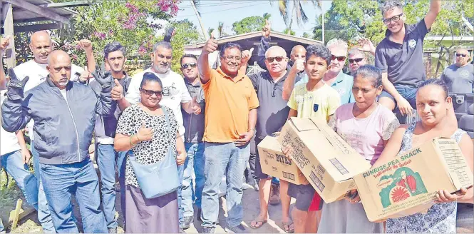  ?? Picture: JONACANI LALAKOBAU ?? Members of the Freedom Riders Associatio­n, Royal Suva Yacht Club and residents of Nanuku settlement get together for a group photo after the handover at the Nanuku settlement in Vatuwaqa, Suva yesterday.