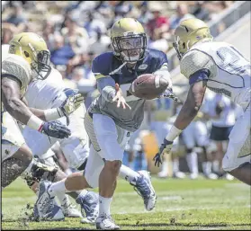  ?? CONTRIBUTE­D BY BRANDEN CAMP ?? Yellow Jackets starting quarterbac­k Justin Thomas, pitching the ball during Saturday’s spring game at Bobby Dodd Stadium, took a hit from his coach for lackluster performanc­e.