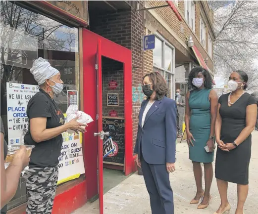  ?? LYNN SWEET/SUN-TIMES ?? Vice President Kamala Harris speaks to an employee at Brown Sugar Bakery on Tuesday. Cook County State’s Attorney Kim Foxx and Lt. Gov. Juliana Stratton look on.