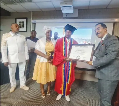  ?? ?? Johanne of the Fifth of Africa leader Andby Makururu (in red gown) is presented with an honorary doctorate from United States-based Logos University for his philanthro­pic works and spreading Christian values across Zimbabwe