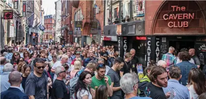  ??  ?? This is now: The crowd yesterday at the modern Cavern club queueing for Sir Paul’s free gig