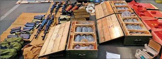  ??  ?? Arsenal: The massive haul of weapons being transporte­d by Moutaux, who was said to have been ‘armed to the teeth and ready to strike’