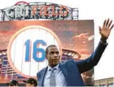  ?? ADAM HUNGER/GETTY ?? Dwight “Doc” Gooden waves to fans during a ceremony to retire his jersey number by the Mets before a game Sunday at Citi Field in New York City.