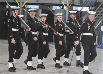  ??  ?? Members of the Assiniboin­e sea cadets guard perform their march-past during their annual ceremonial review.