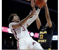  ?? NWA Democrat-Gazette/ANDY SHUPE ?? Arkansas guard Desi Sills attacks the basket as Northern Kentucky forward Dantez Walton defends during the second half Saturday at Walton Arena in Fayettevil­le. Sills, who was 0 of 5 on three-point attempts, finished with a season-high 17 points in the 66-60 victory.