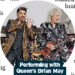  ?? ?? Performing with Queen’s Brian May