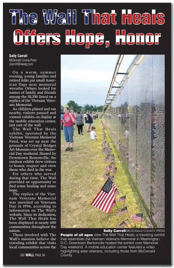  ??  ?? Sally Carroll/MCDONALD COUNTY PRESS
People of all ages view The Wall That Heals, a traveling exhibit that resembles the Vietnam Veterans Memorial in Washington, D.C. Downtown Bentonvill­e hosted the exhibit over Memorial Day weekend. A mobile education center featured a video highlighti­ng area veterans, including those from McDonald County.