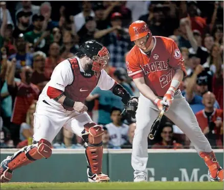  ?? Kathryn Riley Getty Images ?? CATCHER SANDY LEON of the Boston Red Sox tags Mike Trout of the Angels for the final out at Fenway Park. Fenway Park is the only American League ballpark where the Angels star outfielder has yet to hit a home run during his career.