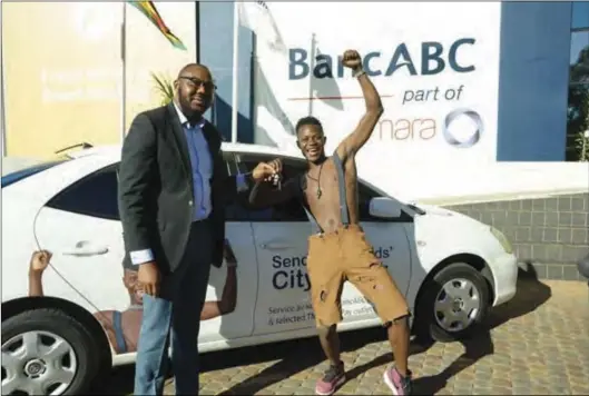  ??  ?? BancABC Zimbabwe CEO Lance Mambondian­i (left) hands over keys of a Toyota Allion car to Zimdanceha­ll Jah Master after the musician was unveiled as the bank’s local remittance service — City Hopper — on Friday.