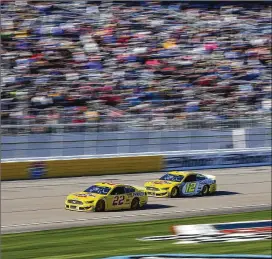  ?? PHOTOS BY CHASE STEVENS / ASSOCIATED PRESS ?? Joey Logano celebrates after winning Sunday’s NASCAR Cup Series race at Las Vegas Motor Speedway. At right, Logano (22) leads Ryan Blaney on the way to the 24th victory of Logano’s career, moving him to 35th on NASCAR’s all-time win list.