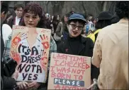  ?? VLADIMIR TRETYAKOV — NUR.KZ VIA AP ?? Women gather for a rally to mark the Internatio­nal Women’s Day in Almaty, Kazakhstan, Wednesday. One of the main demands that the activists voiced at the rally was the adoption of a law on domestic violence.