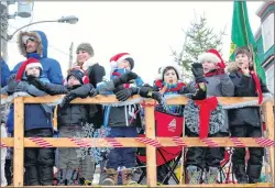  ?? BETH PENNEY/THE TELEGRAM ?? Members of the Cowan Heights Scouts smile and wave to the crowd.