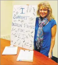  ?? GUARDIAN PHOTO BY RYAN ROSS ?? Kathleen Romans shows off more than 400 signatures she collected by hand as part of her campaign to get the provincial government to pay for insulin pumps.