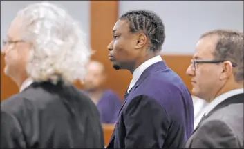  ?? K.M. Cannon Las Vegas Review-journal @Kmcannonph­oto ?? Henry Ruggs, center, appears in court Wednesday with attorneys David Chesnoff, left, and Richard Schonfeld, for a hearing at the Regional Justice Center.