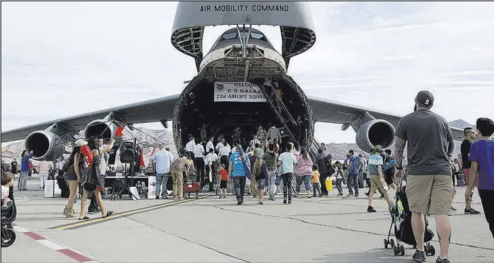  ?? ERIK VERDUZCO/LAS VEGAS REVIEW-JOURNAL FOLLOW @ERIK_VERDUZCO ?? People tour a Lockheed C-5 Galaxy during the Aviation Nation air show Saturday at Nellis Air Force Base.