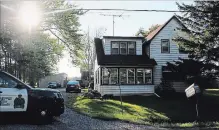  ?? ALLAN BENNER THE WELLAND TRIBUNE ?? A police cruiser in 2016 guards a home beside greenhouse­s used to grow marijuana on Pinecrest Road in rural east Port Colborne.