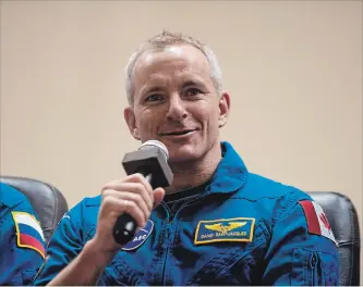  ?? AUBREY GEMIGNANI THE CANADIAN PRESS ?? Expedition 58 flight engineer David Saint-Jacques answers a question during a press conference Dec. 2 in Baikonur, Kazakhstan. The Canadian astronaut arrived at the Internatio­nal Space Station Dec. 3.