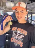  ?? COURTESY OF TAOS HIGH BASEBALL ?? Taos eighth-grader Jalen Montaño holds the all-tournament medal he earned after throwing a no-hitter in the consolatio­n game of the Jim Pierce Memorial Tournament last weekend.