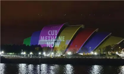 ?? Photograph: Graeme Eddolls/PA ?? A ‘cut methane now’ on the Cop26 summit building in Glasgow. A US/China climate agreement has been broadly hailed as a step in the right direction.