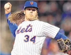  ?? /GETTY IMAGES ?? El derecho Noah Syndergaar­d lanza hoy por Mets ante los Azulejos.