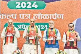  ?? PTI ?? PM Narendra Modi, Union home minister Amit Shah, defence minister Rajnath Singh and BJP chief JP Nadda release the party's election manifesto at the headquarte­rs on Sunday.