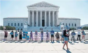  ?? NICHOLAS KAMM AFP VIA GETTY IMAGES ?? The court rejected Louisiana's restrictio­ns on abortion. The court split 5-4 on the decision overruling a state law that requires abortion doctors to have hospital admitting privileges.