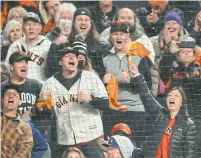  ?? ROBERT GAUTHIER LOS ANGELES TIMES VIA GETTY IMAGES ?? San Francisco Giants fans weren’t shy about expressing their dislike of the Los Angeles Dodgers during Friday’s game.