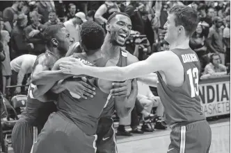  ?? [AJ MAST/THE ASSOCIATED PRESS] ?? Ohio State forward Keita Bates-Diop, back, celebrates a win over Indiana with, from left, Kam Williams, C.J. Jackson and Andrew Dakich.