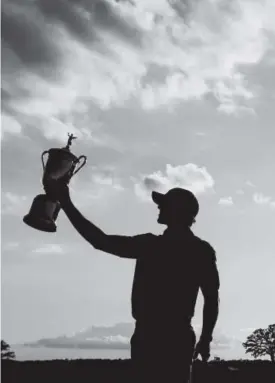  ??  ?? Brooks Koepka, a former Florida State star, poses Sunday with the championsh­ip trophy after winning the 117th U.S. Open. Chris Carlson, The Associated Press