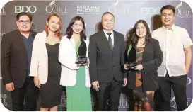  ?? ?? Members of The Philippine STAR and BusinessWo­rld pose for a photo following wins at the 20th Quill Awards