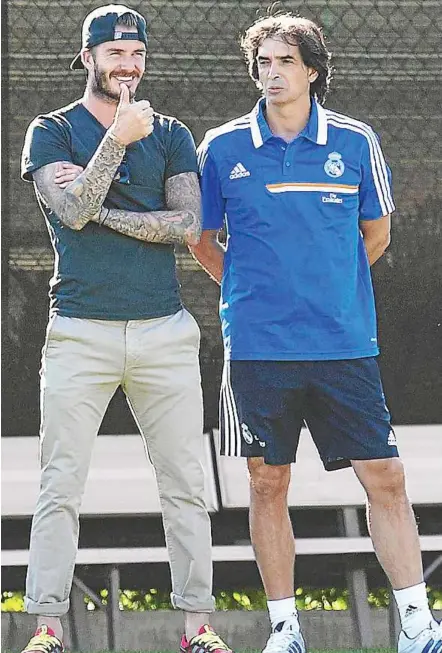  ??  ?? Meeting of old friends: David Beckham (left) giving the thumbs up while watching Real Madrid train at the University of California Los Angeles (UCLA) on Monday. Real will meet LA Galaxy in a friendly tomorrow. — AFP